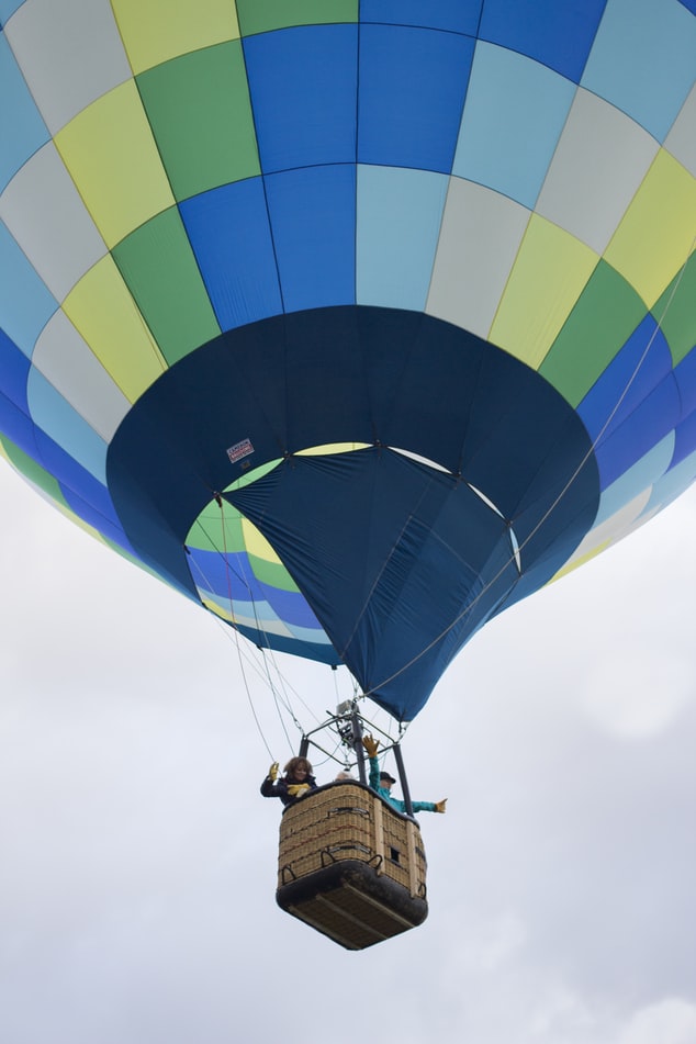 a hot air balloon with travellers