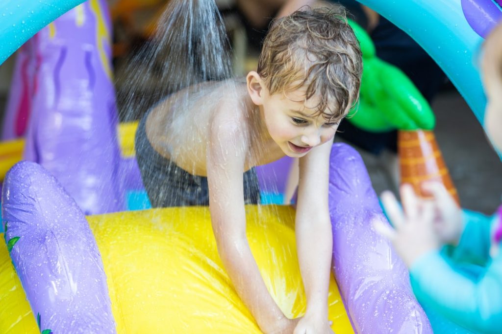 Kid playing at the water parks in New Zealand