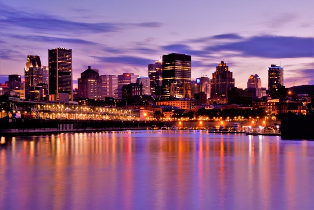 city lights reflecting on beachwaters