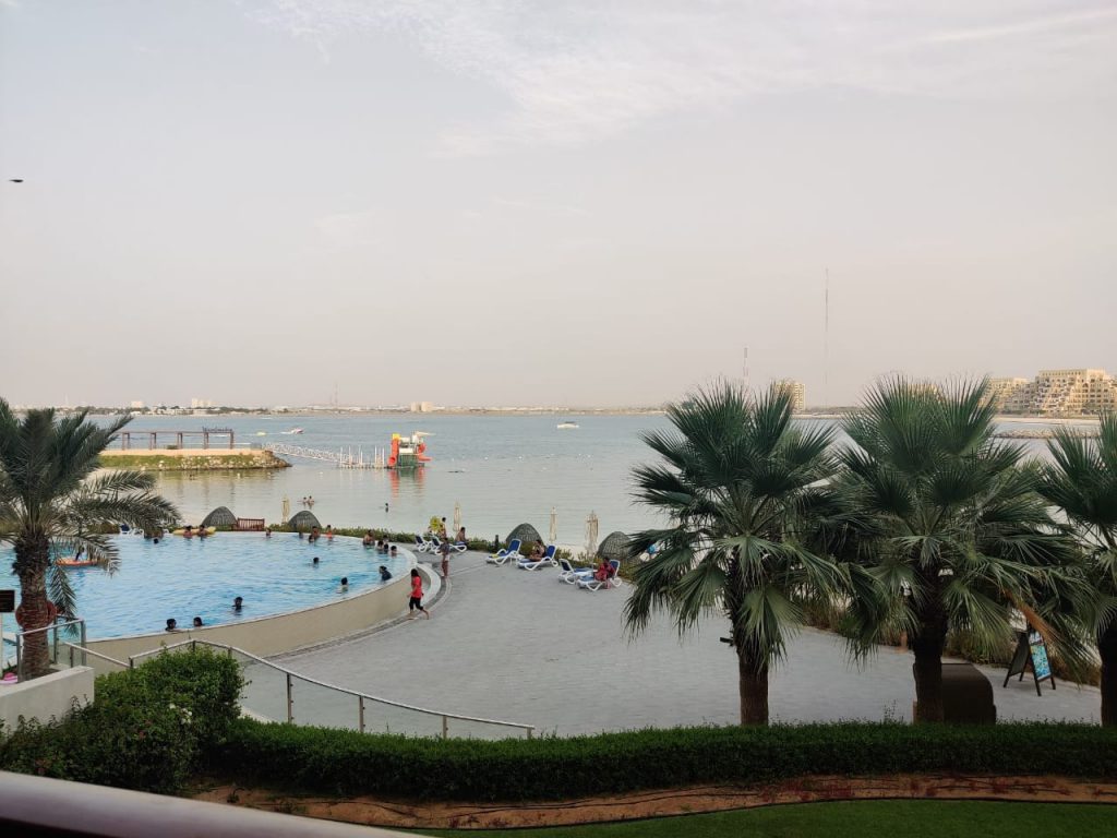 The view of swimming pool and beach