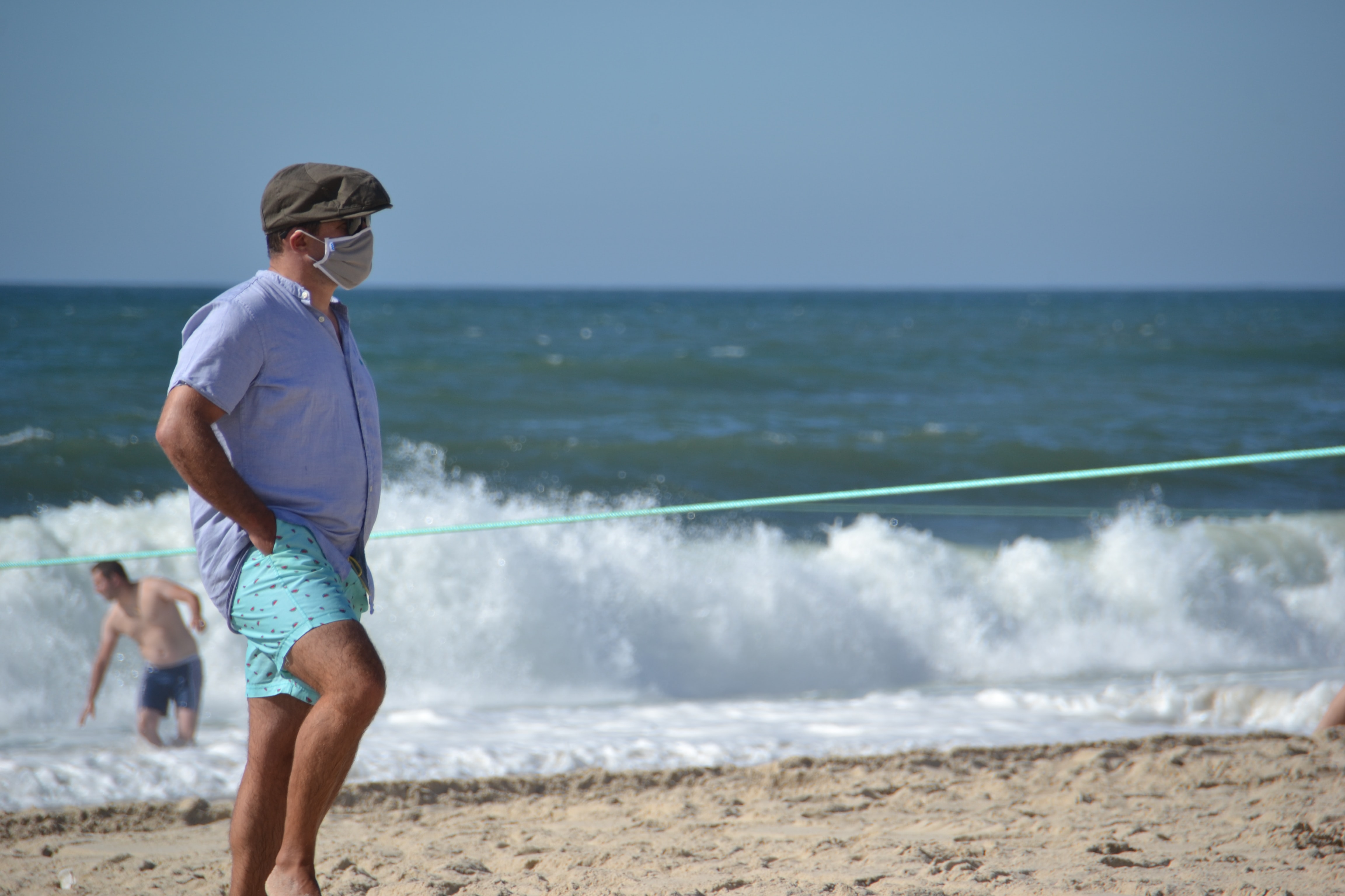 Man wearing mask at a beach.