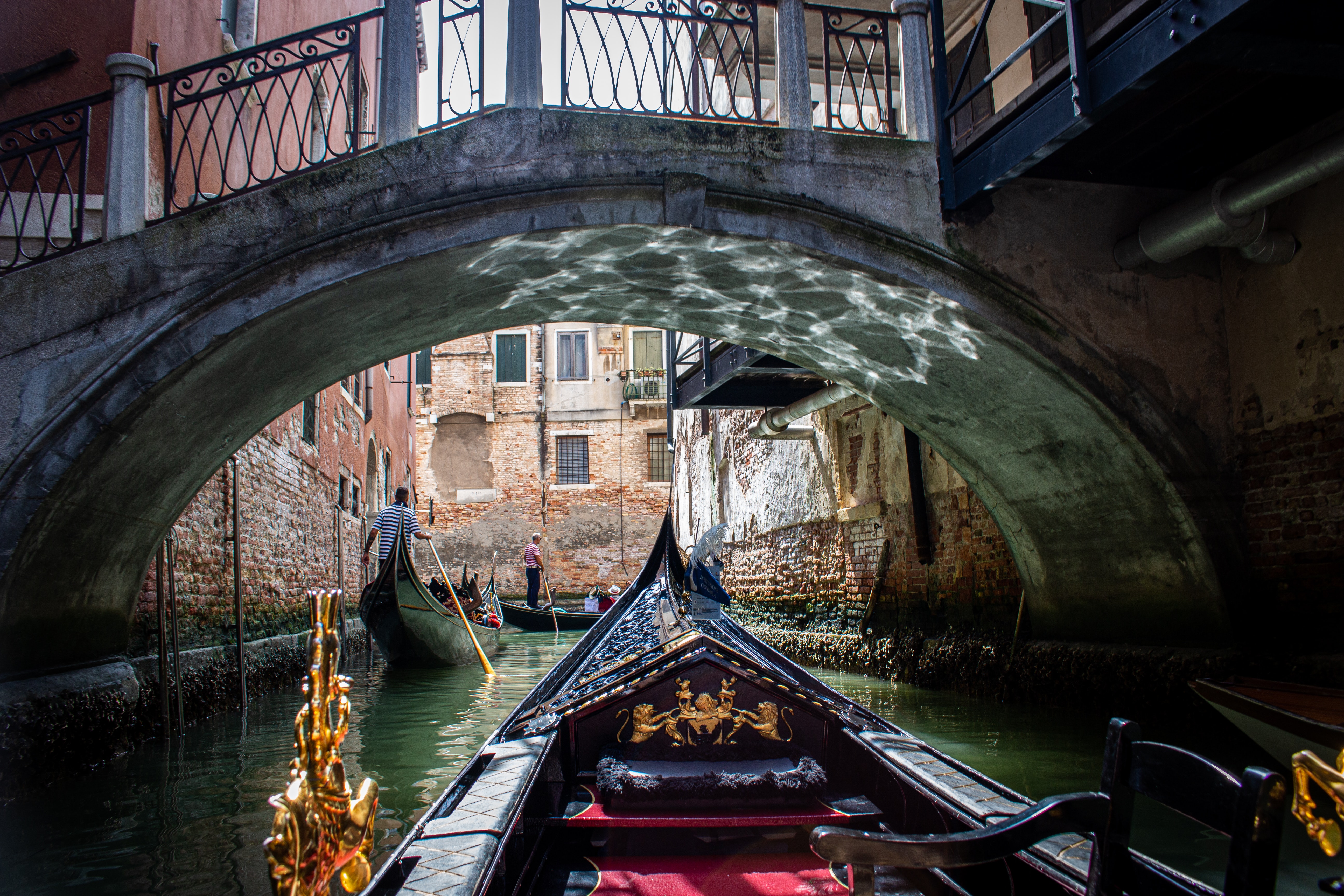 Boats and Ferries sailing through Venice in Italy